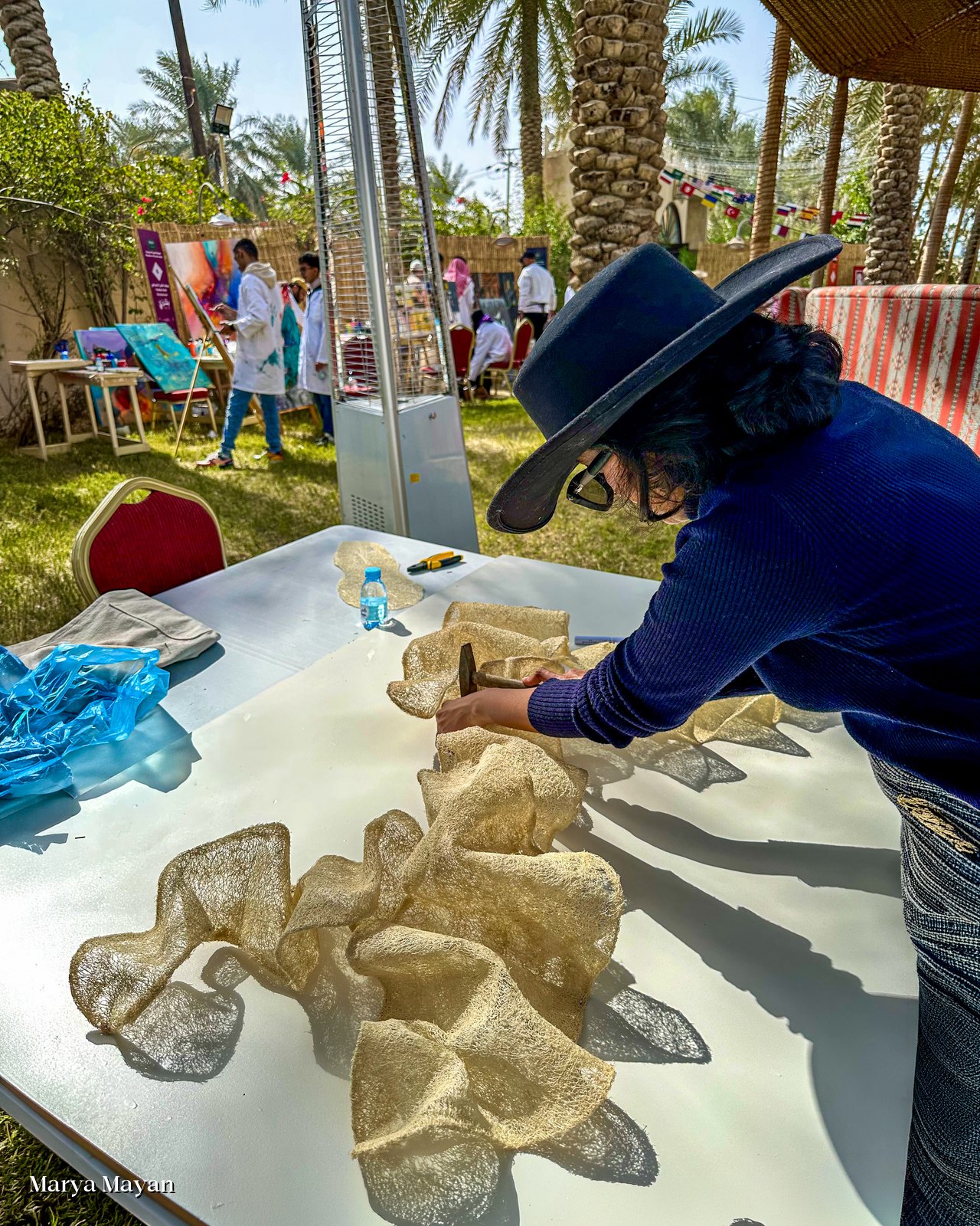Marya Mayan working on the loofah pieces