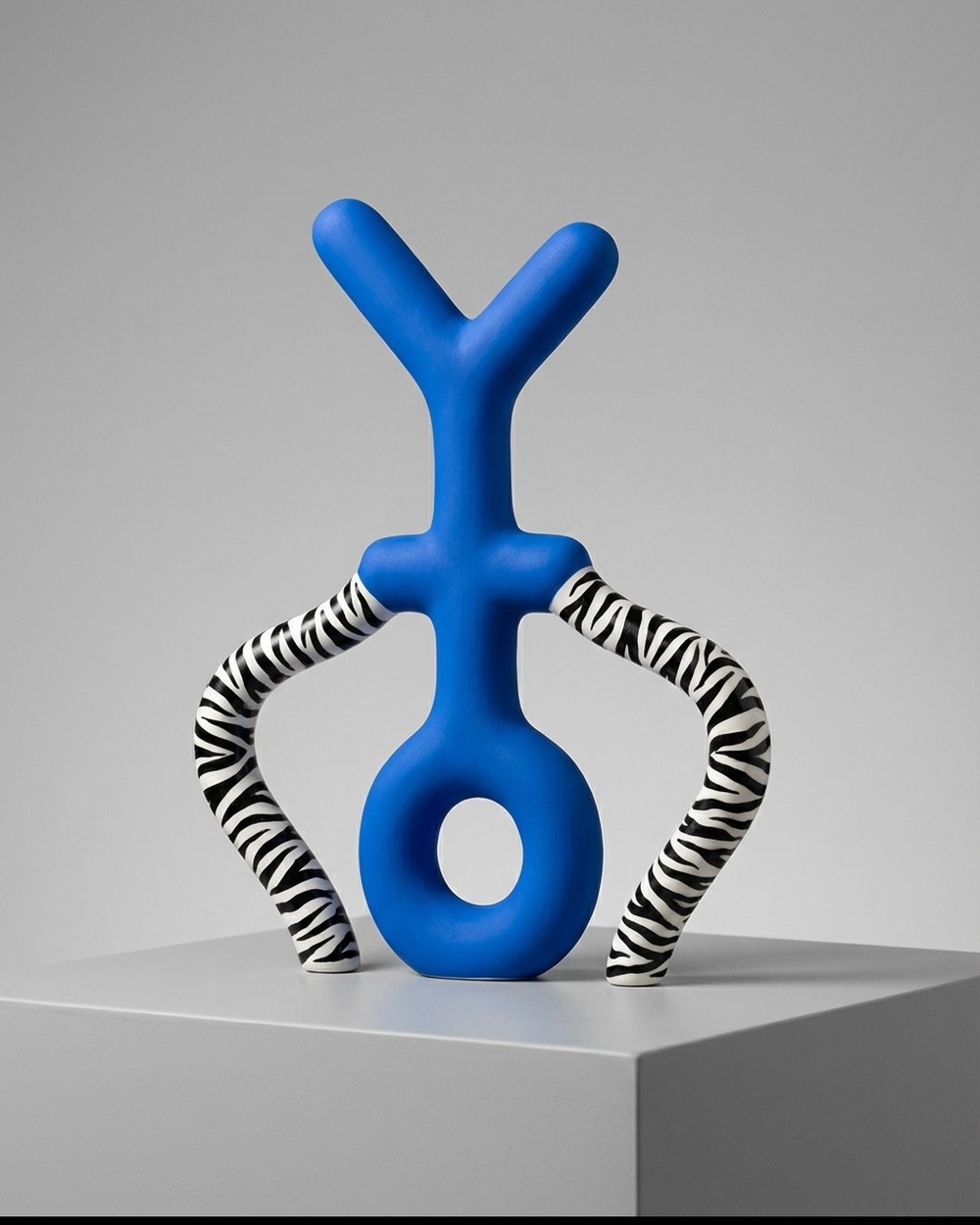 Lahi, the playful ONS character, blue with striped limbs