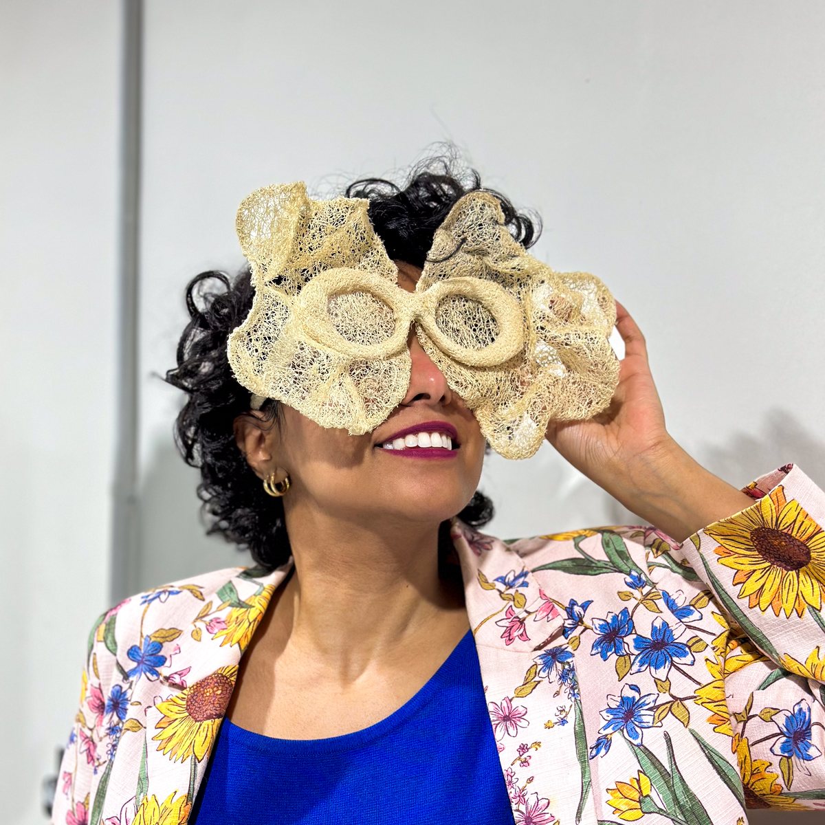 Marya Mayan wearing Third Eye in front of her face, the natural fibers covering the eye area